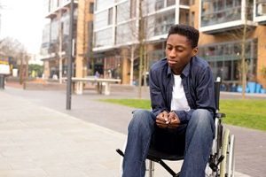 Sad Youth in a Wheelchair | Personal Injury and Depression Often Go Hand-in-Hand