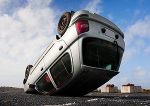 car turned upside-down after road collision | Rollover Accidents Can be Complicated