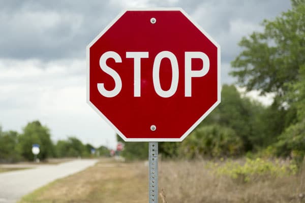 stop sign on a rural road