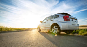 car driving down road in the country | Woodland Park Car Accident Attorneys
