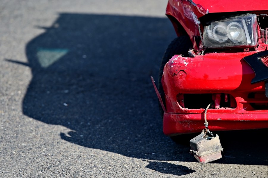 red car on road after a crash | What to do After a Car Accident