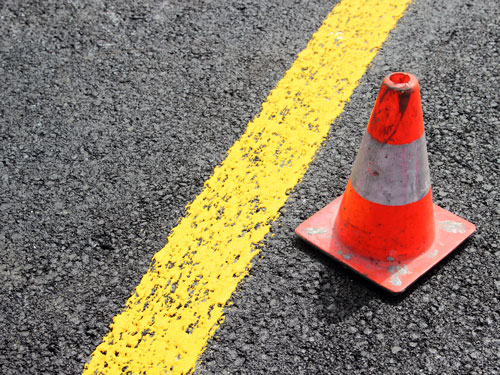 traffic cone next to yellow stripe | Englewood Residents Focus on Safety