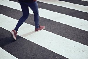 female crossing on a pedestrian lane | Car Accident Deaths Climb to 5-Year Highs